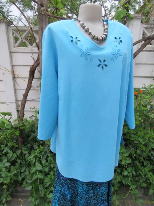 Slip over 100% cotton light turquoise top in size 50/26.Elbow length sleeves.Very good condition.