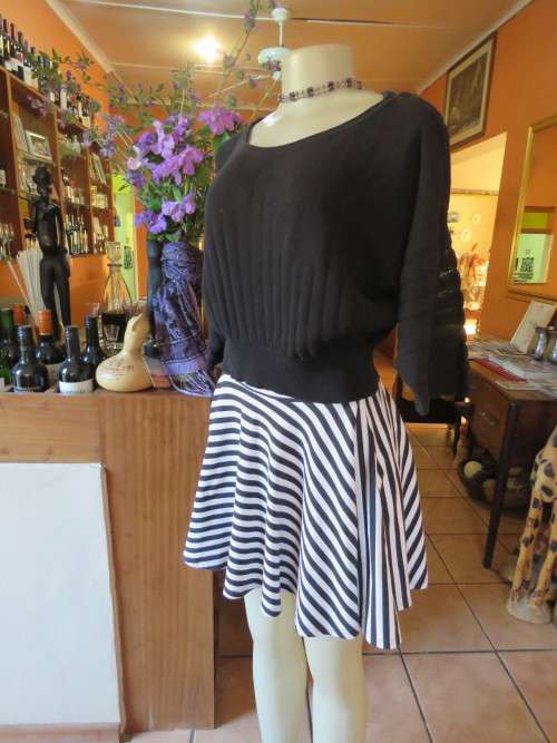 Black knitted top done in cotton and nylon blend yarn.By 'WOOLWORTHS' in 36/12.As new.