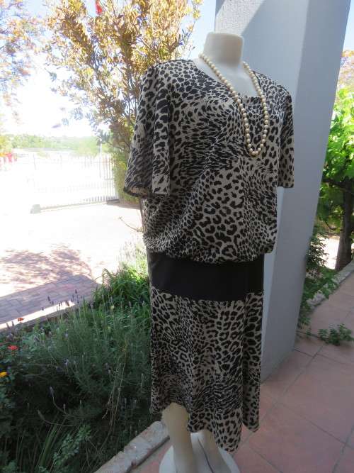 Beautiful animal print dress in beige and black  by 'LARGELY FEMININE' in size 46/22.Good condition.