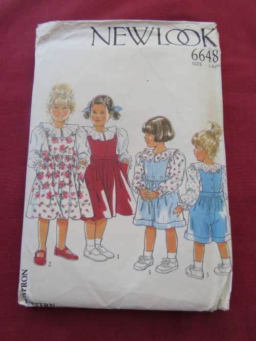 'NEW LOOK' pattern 6648 in sizes 3-8yr for girls blouse,pinafore and dungaree.Good condition.