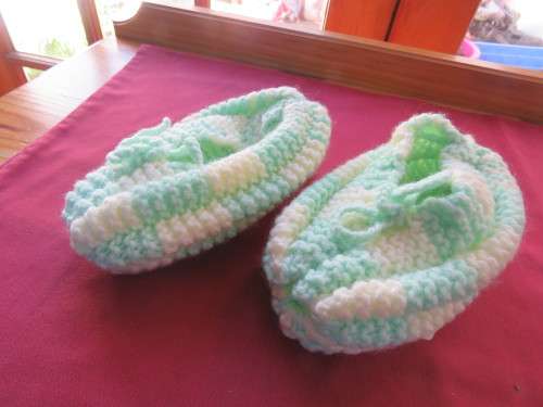 Winter knitted bed socks for girl in mint green and cream.Will fit 9 to 11 year old.