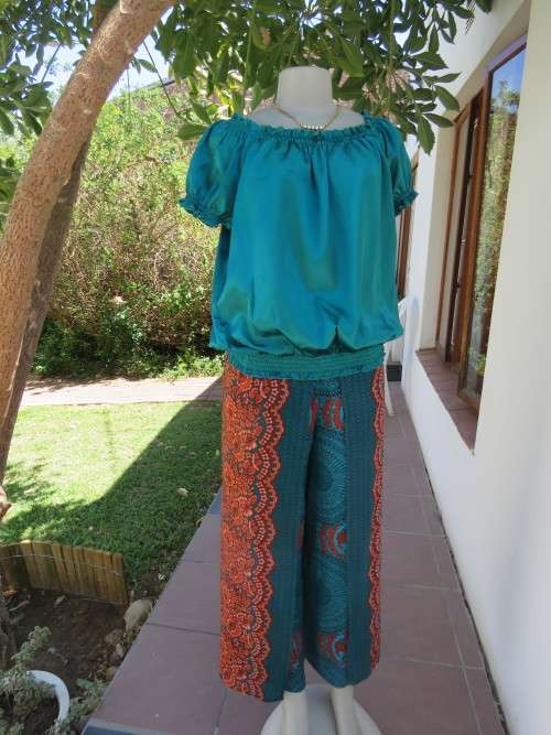 Figure friendly baroque printed jade with brick colour skirt pants in size 34/10.New item.