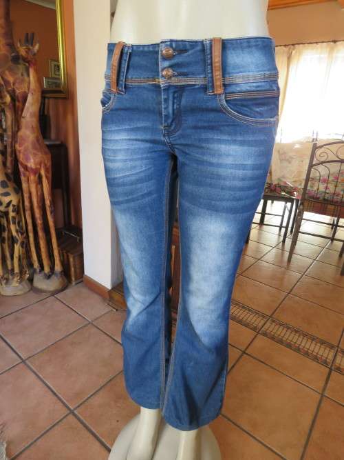 Blue bootleg fashion denim jeans by 'OUTBACK RED' in 33/9.In poly cotton stretch.Good cond.