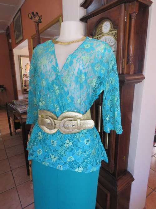 Stunning lace top in turquoise with gold floral pattern by 'TOPICS' in 38/14.New condition.