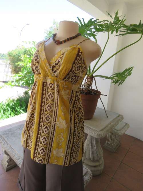 Cool summer strappy top in yellow and brown vertical patterned stripes in size 36/12.Good condition.
