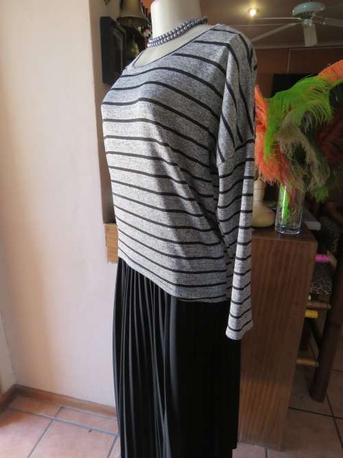 Supersoft stretch polyester pull over top in grey and black stripes.By 'IMAGES' in size 36/12.As new