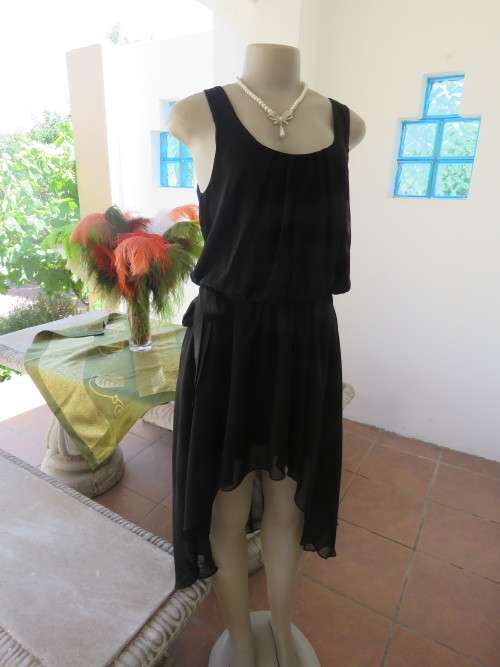 Charming black sleeveless fully lined dress in size 35/11.By 'OLIVE DE OLIVE'.As new.