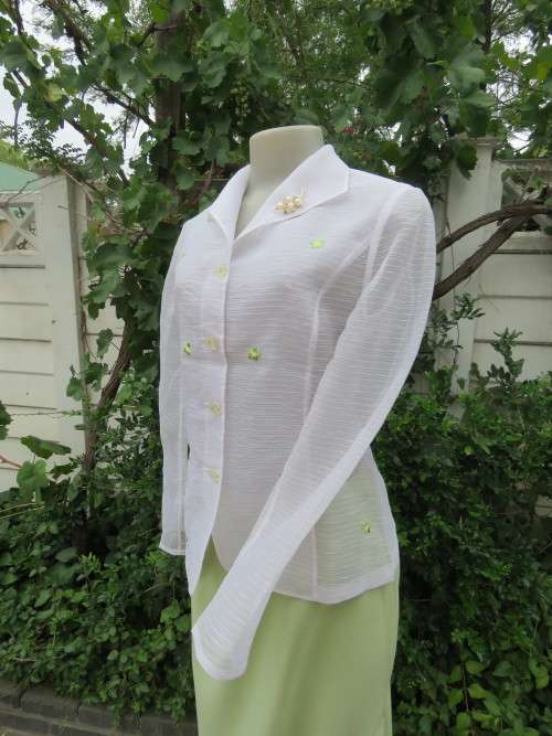 Magnificent white long sleeve see- through top.Size 33/9 in nylon/polyester blend.New top.