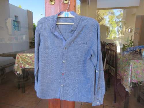 Blue denim colour shirt in 100% cotton.By 'WOOLWORTHS' for boy 9-10 yr old boy.As new.