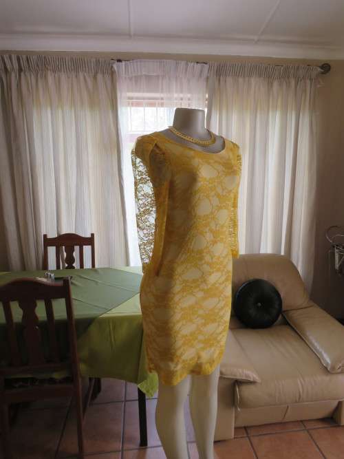 The new black!!!Gold colour bodycon lace dress by `DRAMAQUEEN` in size 32/8.New dress.