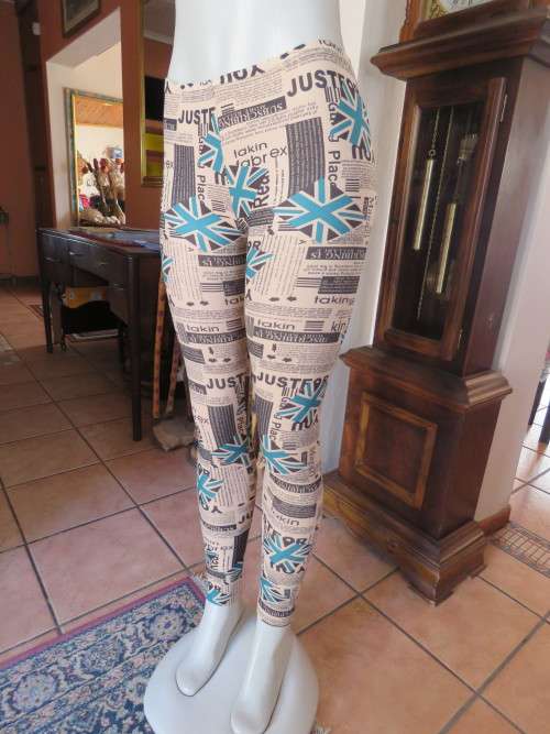 Cream leggings with green and black logos.Size 32/8.In stretch polyester.New item.