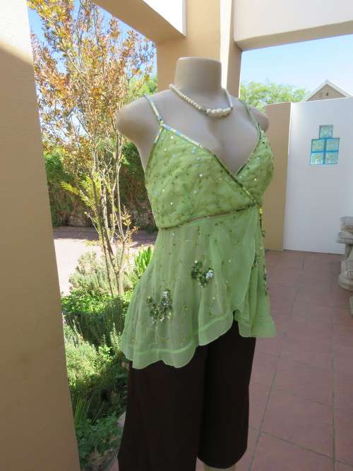 Glamour strappy top in apple green sheer 100% polyester.Size 38/14 by 'TRUWORTHS'.Good condition.
