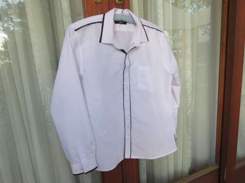 Snow white long sleeve formal shirt with black edging.By 'CHANCELLOR BOY' for 13-14 yr.Used once.