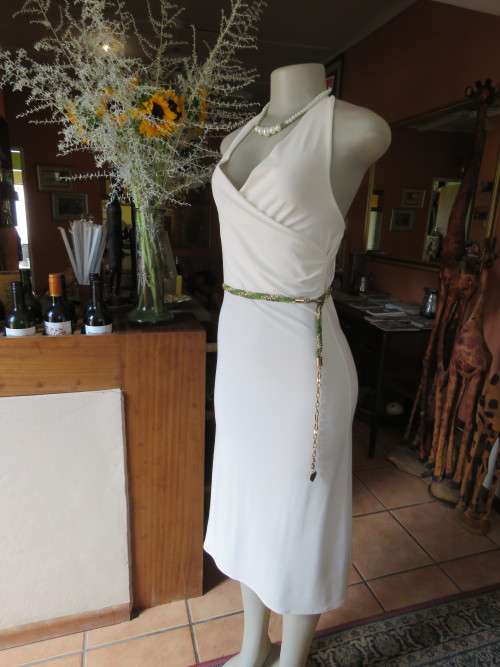 Cocktail dress in soft cream colour suitable for day or evening.Size 32/8 by 'ANGEL FASHION'.As new.
