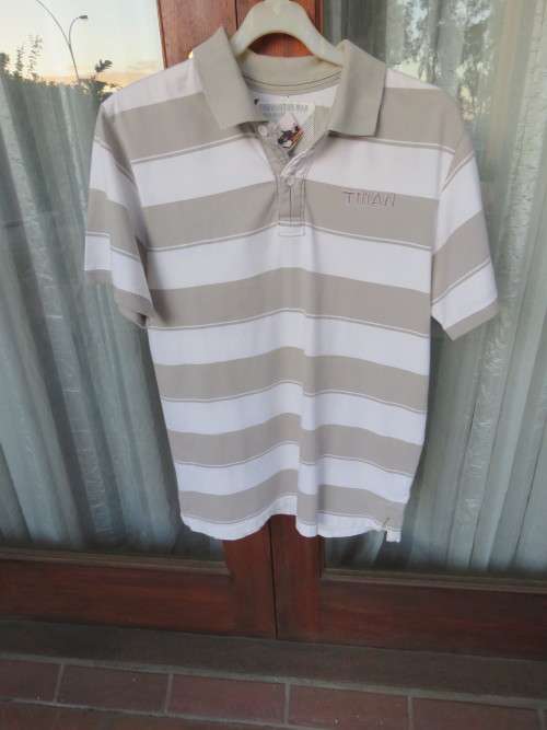 'TRUWORTHS MAN' golf shirt.Size Medium with white/fawn horizontal stripes.Good condition.