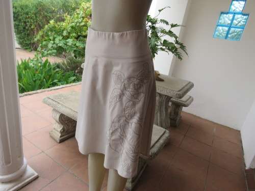 Embroidered A-line beige skirt in size 32/8 by `NETWORK` with yoke and zip at back. As new