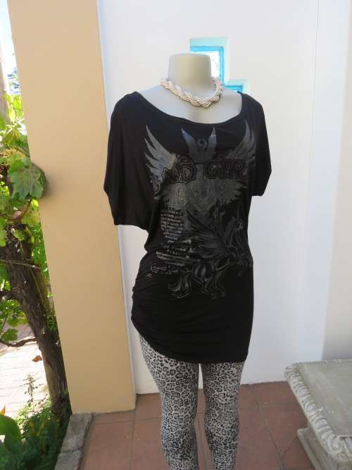 Fashion black long top with 'BAD GIRL' shiny logo.Size 34/10 in polyester,viscose stretch.As new.