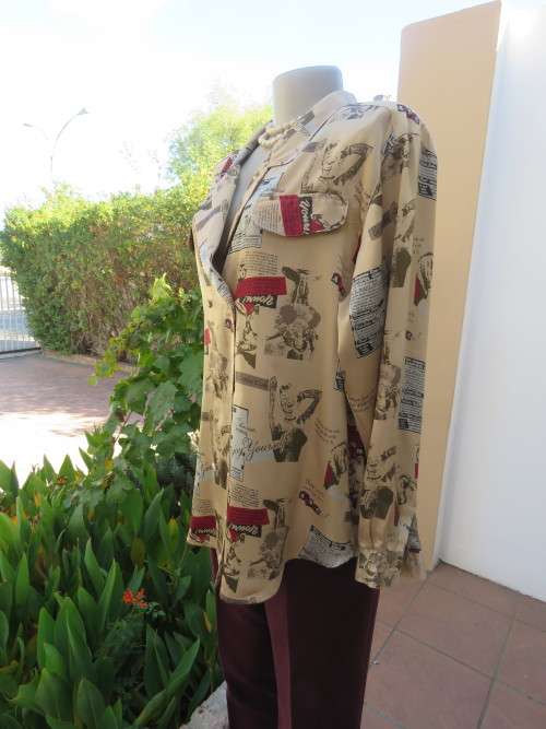 Innovative silky polyester double breast top in size 40/16.By 'ELL PATARA' with cuffed sleeves.New.