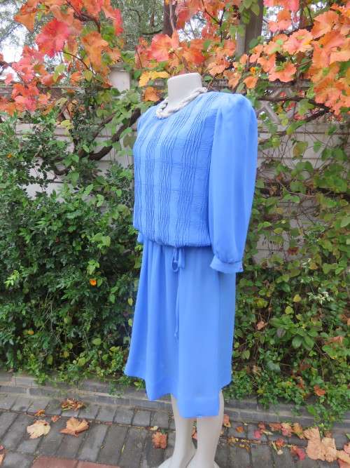 Skyblue vintage dress by 'LORAC ORIGINAL'.Size 42/18.In sheer polyester fabric.New condition.