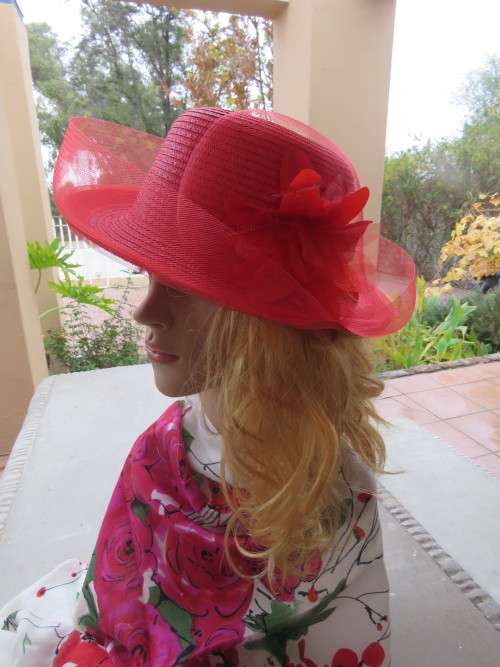 Eyecatching crimson red straw hat with firm netting rounding.Flower decoration.New condition.
