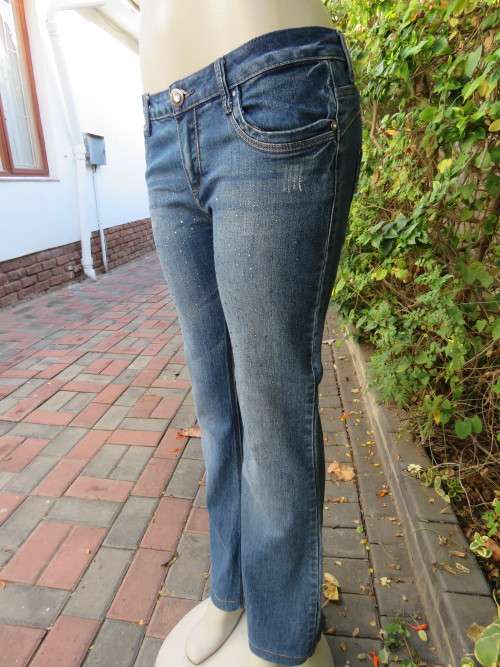 Top of the line blue denim jeans by 'ANGELA BABY' in 36/12.New .Never used.