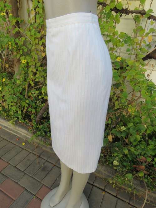 White fully lined pencil skirt with thin vertical turquoise stripes.Size 38/14.New condition.