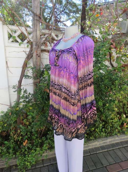 Fabulous long top in permanent pleating with empire waist.Size 38/14.As new.