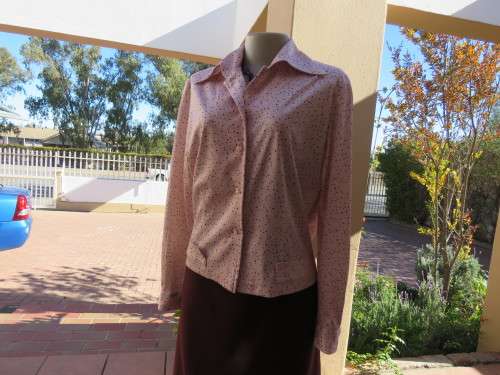 Pale pink long sleeve button down top with multi colour polkadots.Size 36/12.Very good cond.