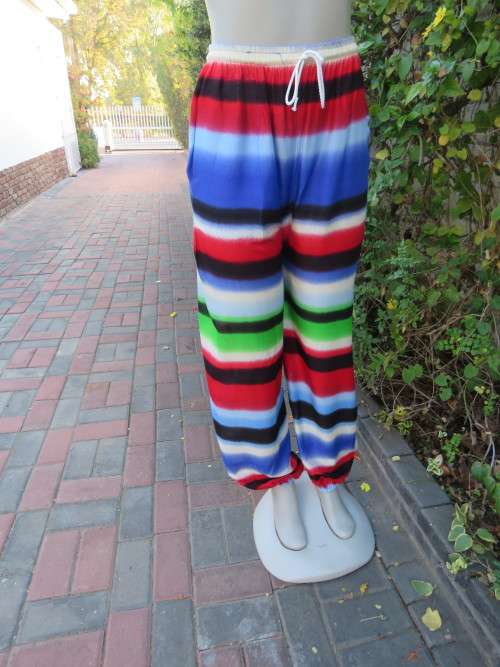 Bo-ho long pants with elasticated leg seams and waist.Loose fit in size 34/10.New item.