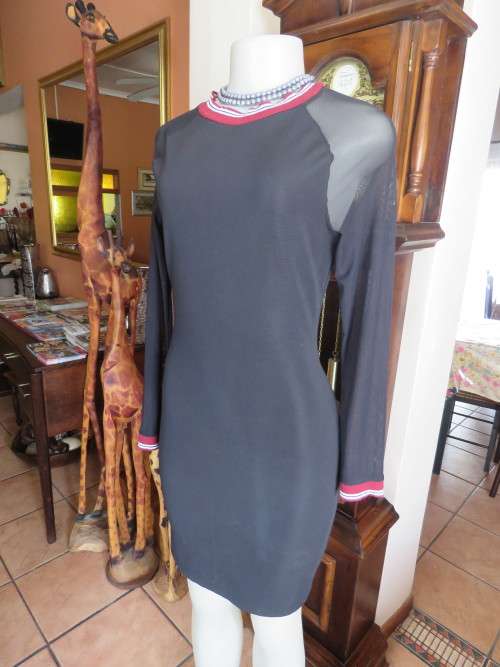 Chic fashionable `MISS L` bodycon black dress in size 32/8.In 100% stretch polyester fabric.As new.