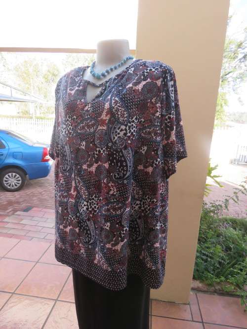 Bo-ho print top in blue,white and orange colour.By 'MILADY'S' IN 50-52.As new.