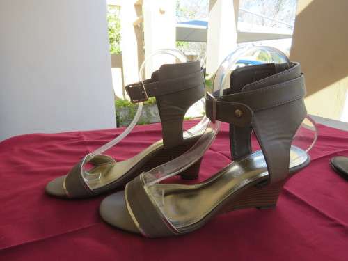 Pair of khaki colour platform heel size 7 shoes from 'TRUWORTHS' with gold decoration.As new.