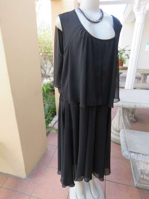 Glamorous sleeveless black special occasion dress by 'DONNA CLAIRE' in 50/26.New condition.