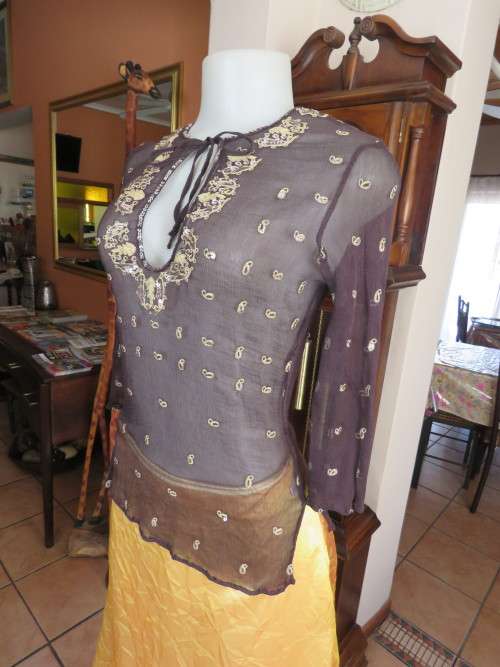 Amazing 100% black silk top with bracelet length sleeves in 32/8.Embellished in gold/sequins.As new.