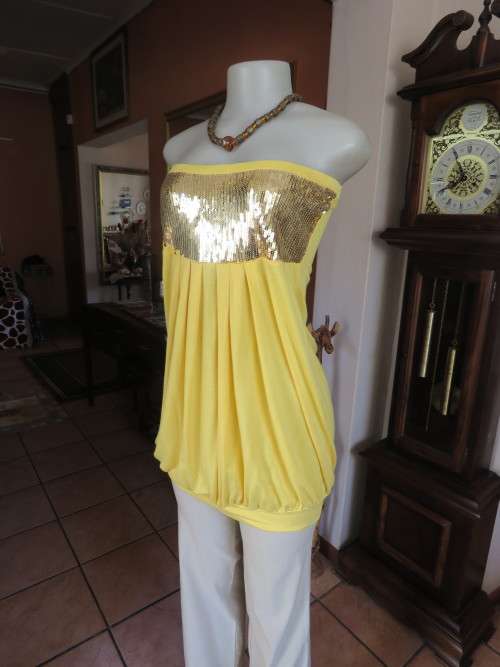 Buttercup yellow long top in bubble style.Size 36/12 with wide sequin embellishment front.Good cond.