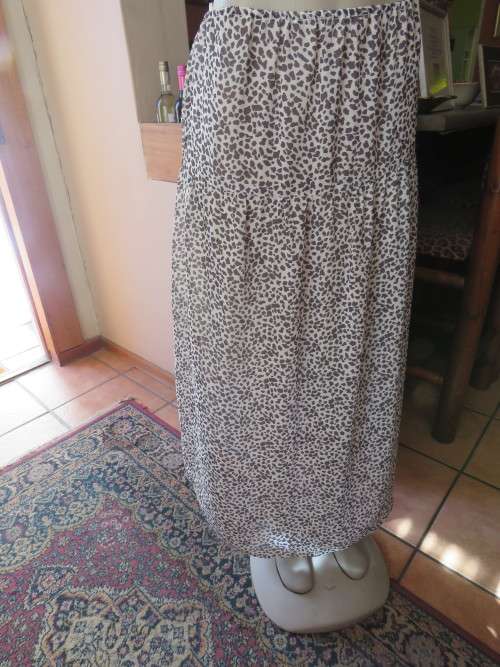 Monochrome sheer polyester long skirt with animal print.Size 38/14 with yoke.Used fine for home wear