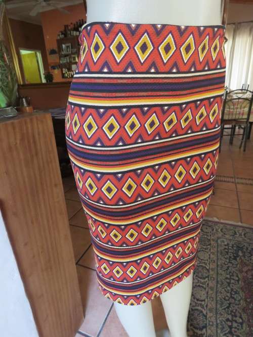 Smart ethnic bodycon stretch skirt in autumn colours by`OBR` in size 32/8.New cond.
