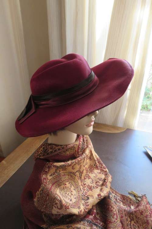 Vintage cambric bowler style hat in maroon with double bow at back.As new.