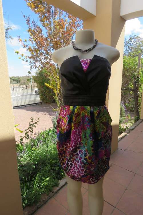 Sexy strapless short dress with black satin bust by `FASHION EXPRESS` in size 36/12.As new.
