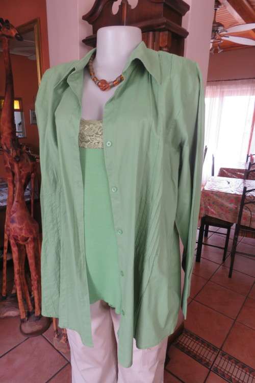 Pretty avo green long sleeve top with attached strappy top by 'INSYNC' in size 44/20.Good cond.