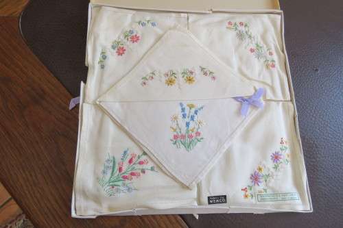 Pure linen embroidered hankies.Siz of them in original box.Fabric by WEMCO.Still new.