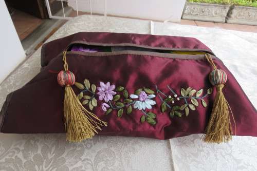 Shiny mahogany colour satin padded tissue box cover with tussel at each side.New.
