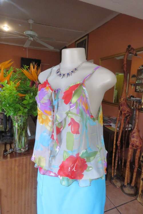 Sexy sheer strappy top in silver grey with bold colourful flowers.Size 40/16.Used condition.