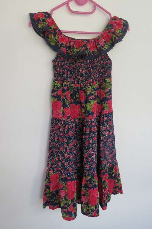 Cheeky little tiered bottom dress in navy with pink/red flowers Top elasticated. For 8 to 9 year