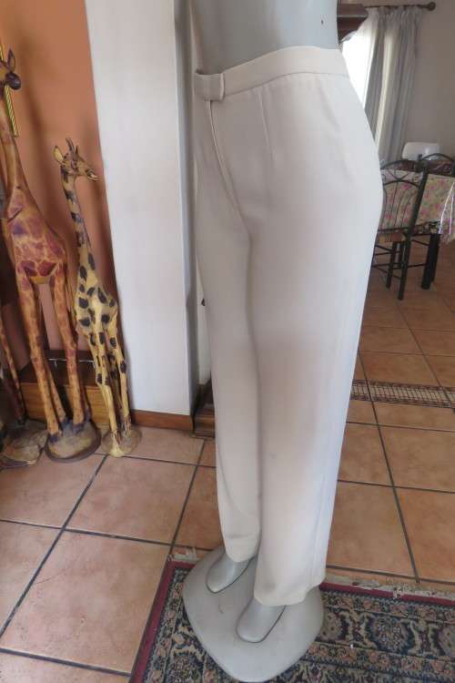 Smart, elegant `Miss Cassidy`rich cream  long ladies straight legged pants. In size 34/10.