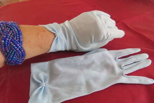 Pair of powder blue chiffon gloves. Size Medium. As new.