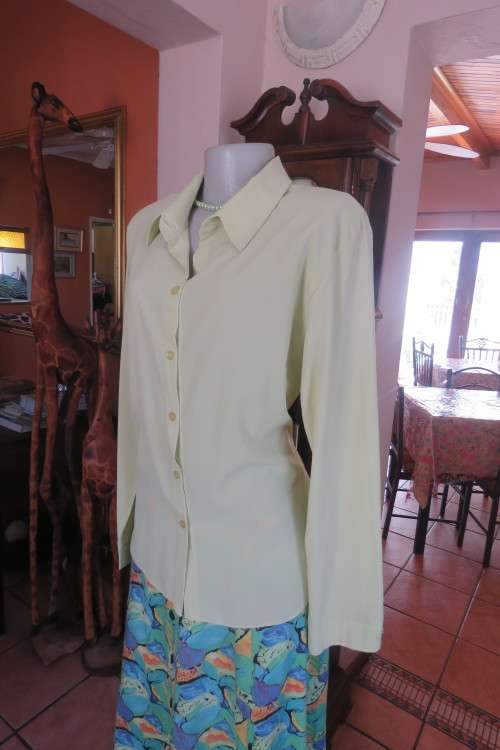Apple green long sleeve top by 'Michaela' in size 38/14, with button down front and open collar.