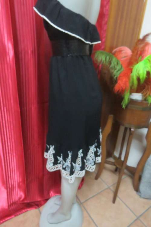 Ultra sexy black strapless dress with Frill on elasticated top. Size 34/10 by `Mozaic`.As new
