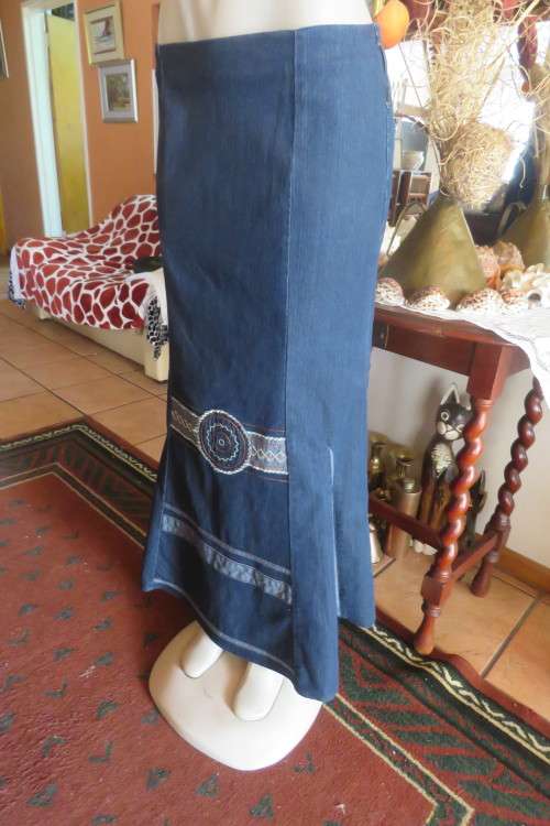 Top of the line ankle length trumpet style cotton stretch denim skirt in size 36/12.