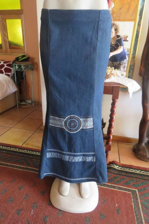Top of the line ankle length trumpet style cotton stretch denim skirt in size 36/12.